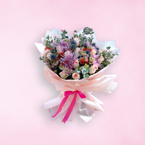 bouquet of mixed flowers wrapped in white