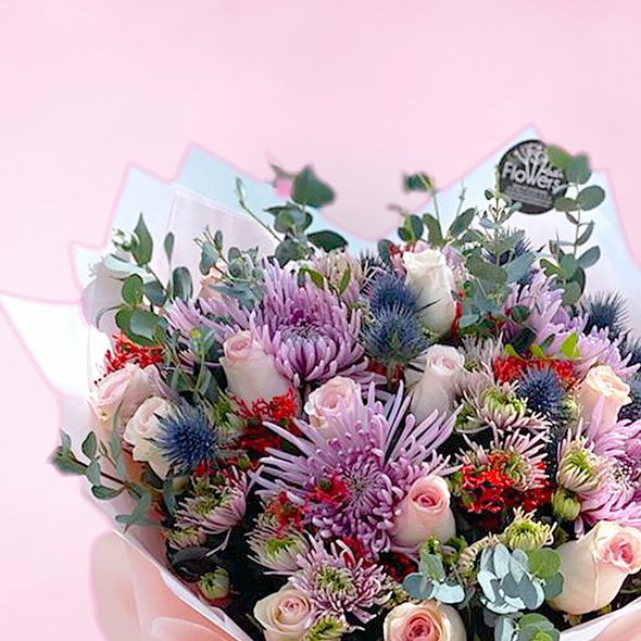 bouquet of mixed flowers wrapped in white